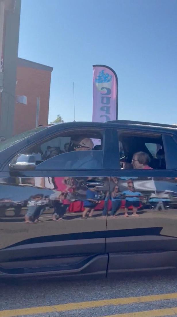 Former U.S. President Jimmy Carter and his wife, former first lady Rosalynn Carter sit inside a car, in Atlanta