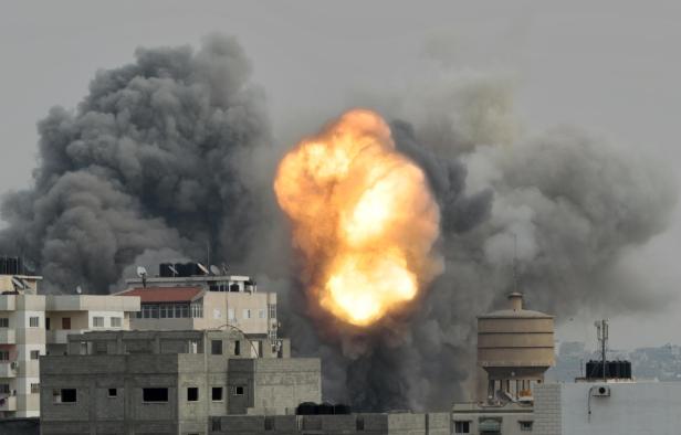 Smoke and explosion are seen during Israeli airstrikes witnessed by Reuter's photographer in Gaza City