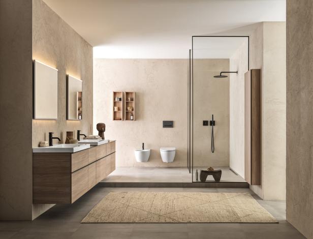 Ein modernes Badezimmer mit Doppelwaschbecken, Dusche und beigem Teppich.