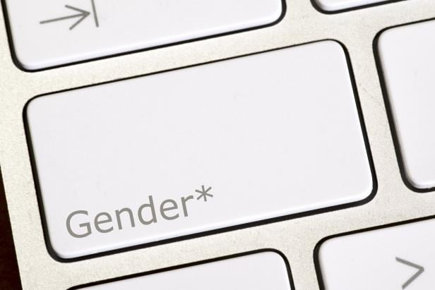 A computer and button for gender