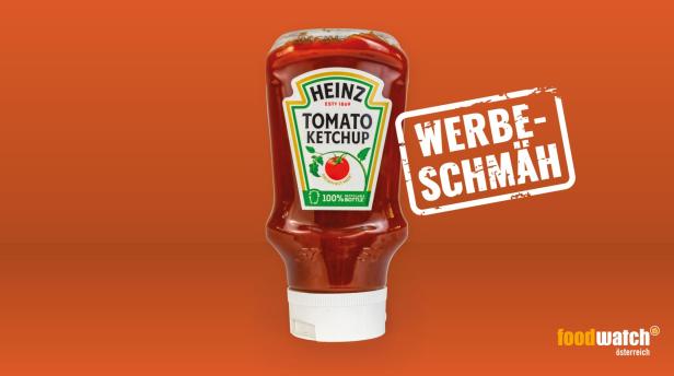 Eine Flasche Heinz Tomato Ketchup vor einem orangefarbenen Hintergrund mit dem Schriftzug „Werbeschmäh“.