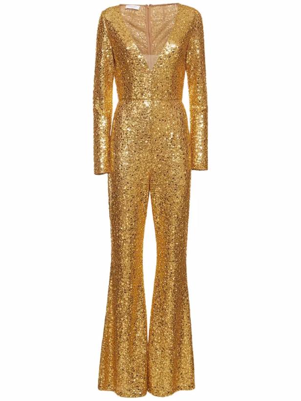Ein goldener Pailletten-Jumpsuit mit langen Ärmeln und Schlaghosen.