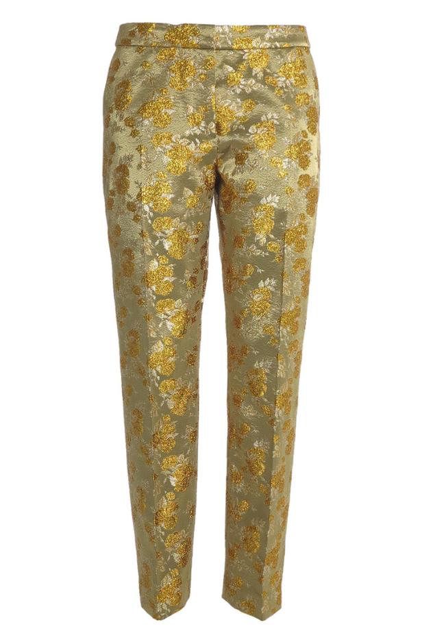 Eine goldene Hose mit einem floralen Muster.