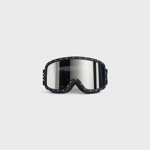 Eine schwarze Skibrille mit verspiegelten Gläsern vor einem hellgrauen Hintergrund.