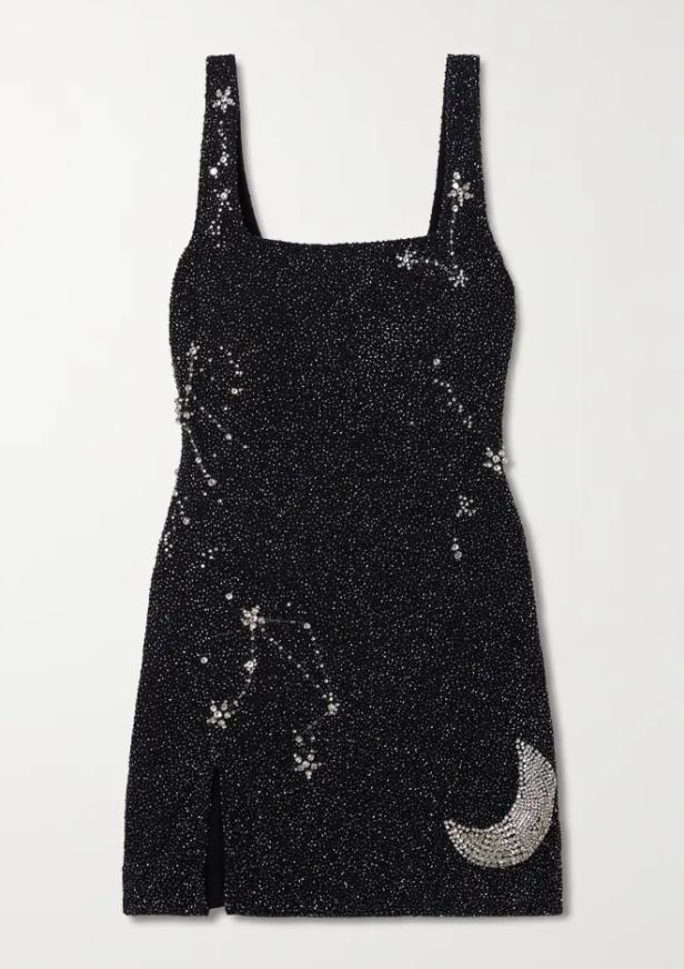 Ein schwarzes, glitzerndes Minikleid mit Sternbildern und einer Mondsichel.