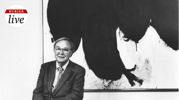 Robert Motherwell, in a 1986 photograph, seated in front of his painting Elegy to the Spanish Republic No. 70