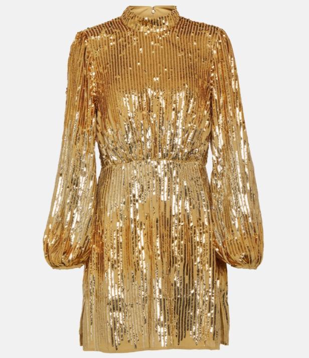 Ein kurzes, goldenes Paillettenkleid mit langen Ärmeln.