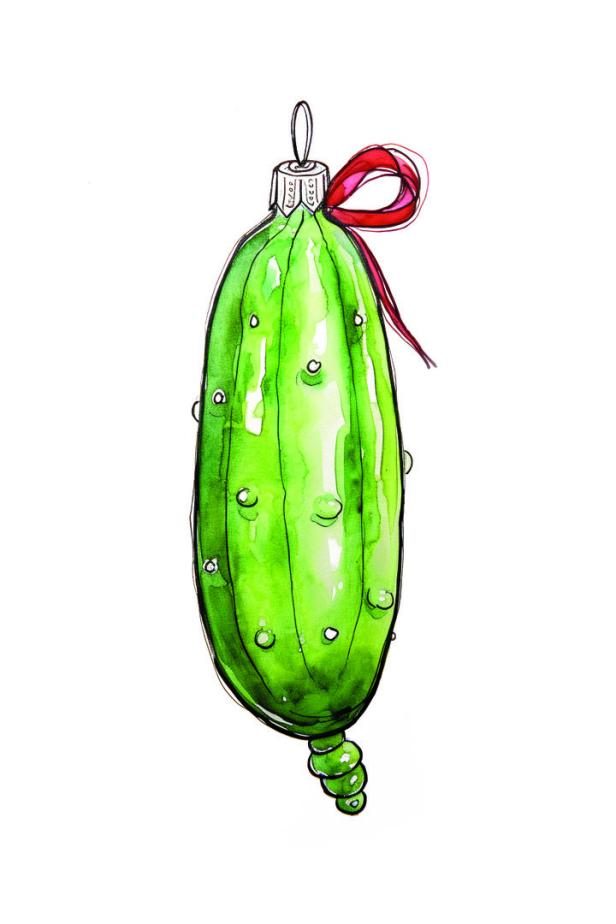 Eine grüne Gurke als Weihnachtsschmuck mit einer roten Schleife.