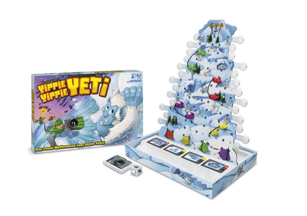Das Brettspiel „Yippie Yippie Yeti“ mit einem Yeti-Thema und kleinen Spielfiguren auf einem Bergparcours.