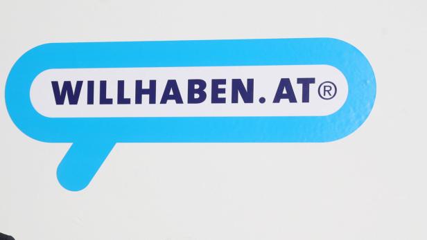Das Logo von „willhaben.at“ in einer blauen Sprechblase.