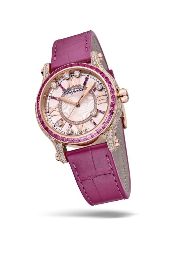 Eine Chopard Damenuhr mit rosafarbenem Lederarmband und Diamanten auf dem Zifferblatt.