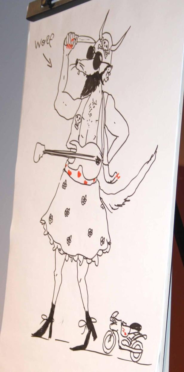Eine Zeichnung eines Wolfs mit Sonnenbrille, Rock, Gitarre und Motorrad.