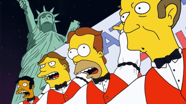 Eine Gruppe singender Simpsons-Figuren vor der Freiheitsstatue.