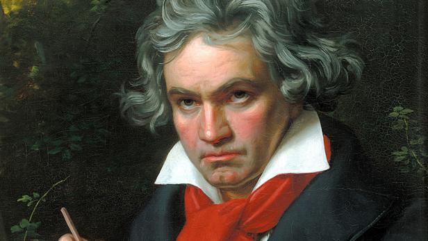 Ein Porträt von Ludwig van Beethoven mit einem Stift in der Hand.