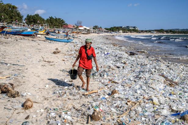Plastic waste covers beach on the coast of Bali