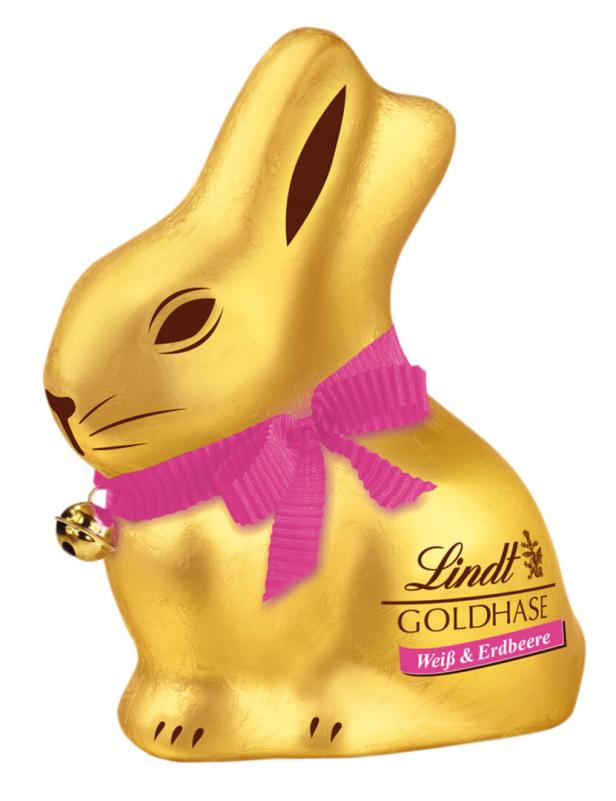 Ein goldener Lindt-Schokoladenhase mit rosa Schleife und Glöckchen.