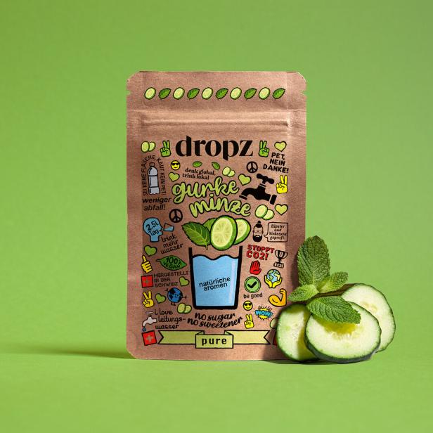 Eine Packung Dropz „Gurke Minze“ mit Gurkenscheiben und Minze auf grünem Hintergrund.