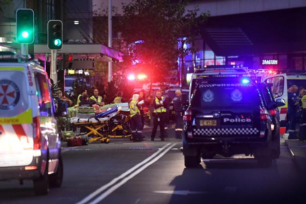 Emergency service workers work near Bondi Junction after multiple people were stabbed inside the Westfield Bondi Junction shopping centre in Sydney