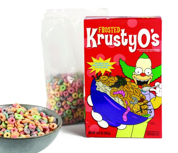 Eine rote Kartonpackung mit den KrustyO´s, das sind bunte Frühstücksringerl, für die Krusty, der Clown Werbung macht.