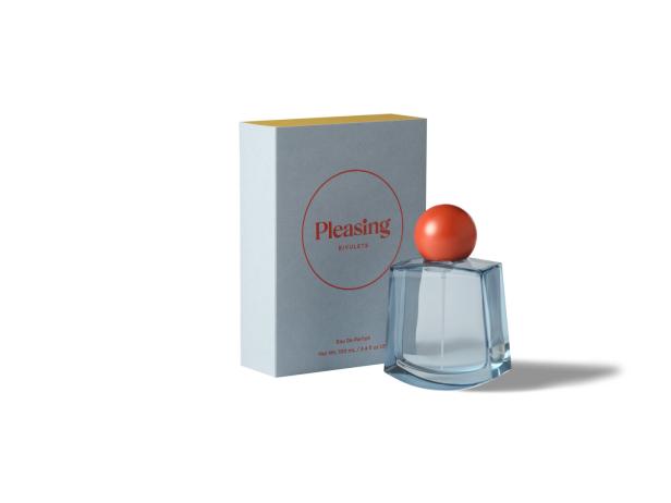 Ein Flakon des Parfüms „Pleasing Rivulets“ neben seiner Verpackung.