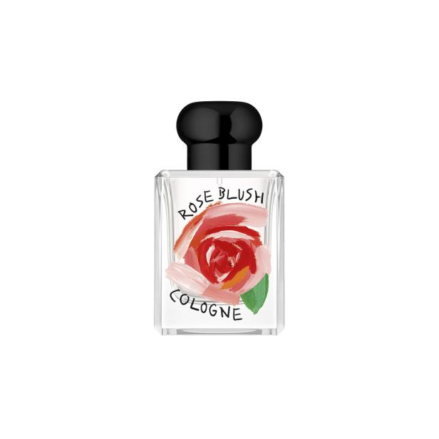 Eine Flasche „Rose Blush Cologne“ mit einer gemalten Rose auf dem Etikett.