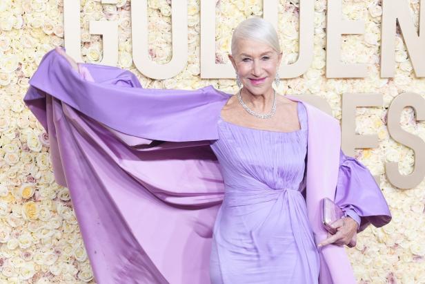 Helen Mirren in einem lila Kleid auf dem roten Teppich der Golden Globes.