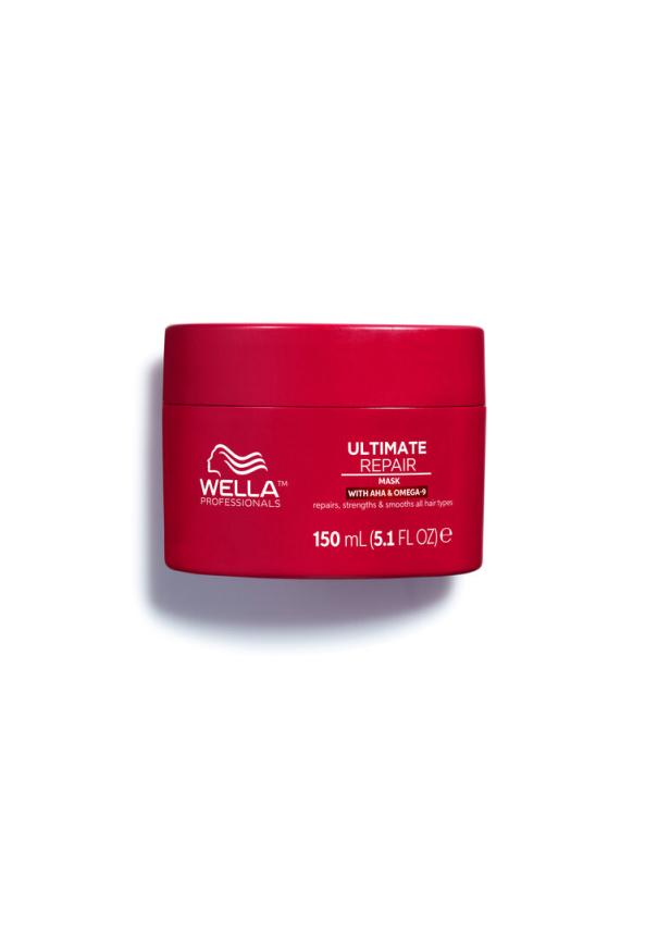 Eine rote Dose der „Ultimate Repair Mask“ von Wella Professionals mit AHA und Omega-9.