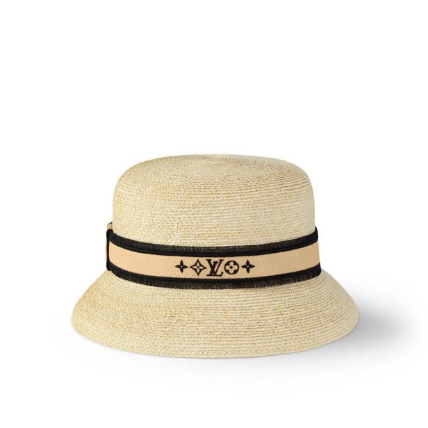 Ein Strohhut mit einem Band mit dem Louis Vuitton-Logo.