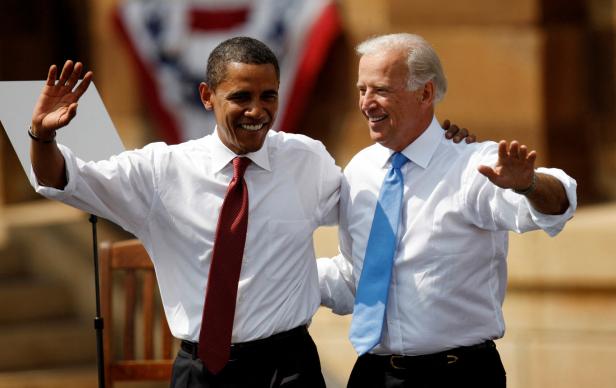 FILE PHOTO: Barack Obama waves at campaign event with his vice presidential running mate Senator Joe Biden in Springfield