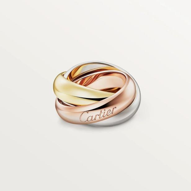 Ein Trinity Ring von Cartier aus Gelbgold, Roségold und Weißgold.