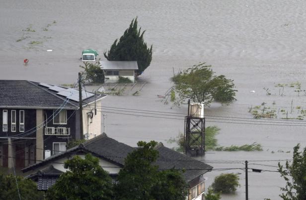 A farmland is submerged due to floods caused by heavy rains from Typhoon Shanshan in Yufu, Oita Prefecture, southwestern Japan