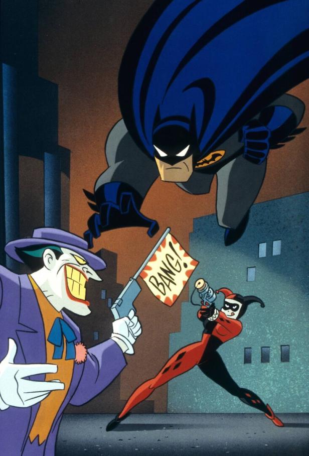 Ein Ausschnitt aus einem Zeichentrickfilm der „Animated Serie“: Joker hält Batman eine Pistole entgegen, aus der eine Fahne mit „Bang!“ -Schriftzug schießt. Harley Quinn mit Harlekinkostüm zielt auch auf den Superhelden.