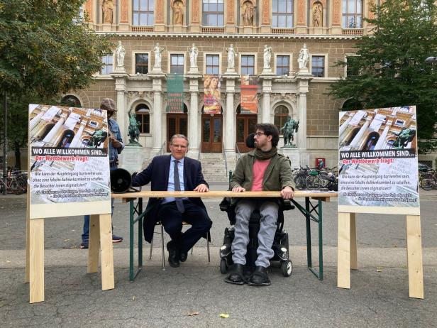 A student in a wheelchair is looking for ideas for a barrier-free main entrance to the university