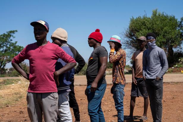 Volunteers in a rescue operation to bring miners to the surface in a standoff between the police and illegal gold miners escorted by the police to the mineshaft in Stilfontein