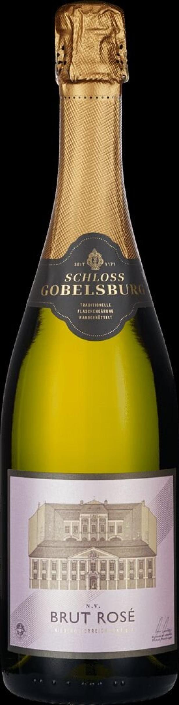 Eine Flasche „Schloss Gobelsburg Brut Rosé“ Sekt vor schwarzem Hintergrund.