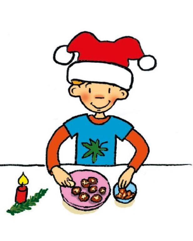 Ein Junge mit Weihnachtsmütze brät Maronen.