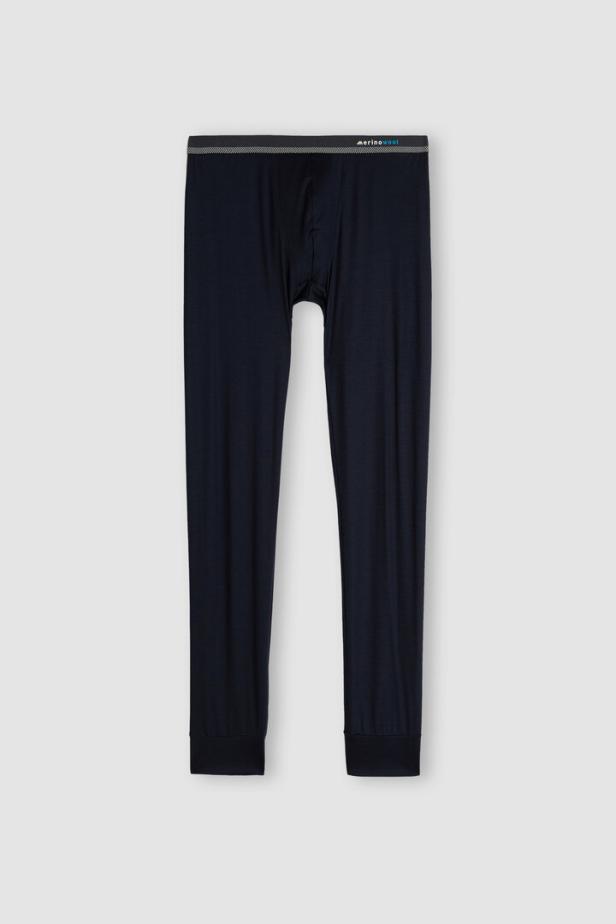 Eine lange, marineblaue Merino-Unterhose vor einem hellgrauen Hintergrund.
