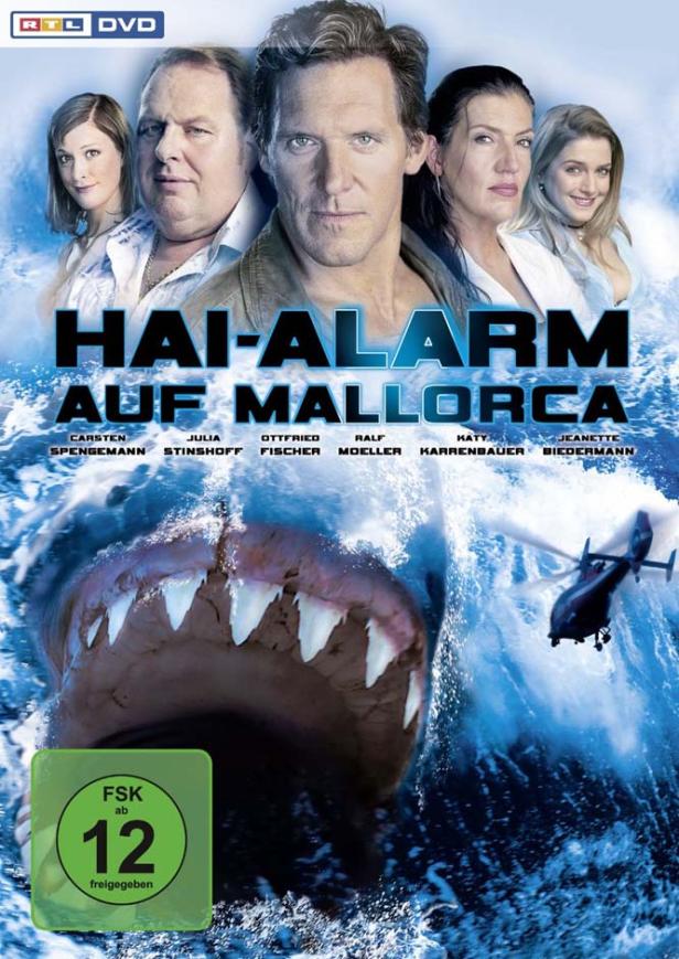 Das Cover des Films „Hai-Alarm auf Mallorca“ zeigt einen Hai, einen Hubschrauber und mehrere Schauspieler.