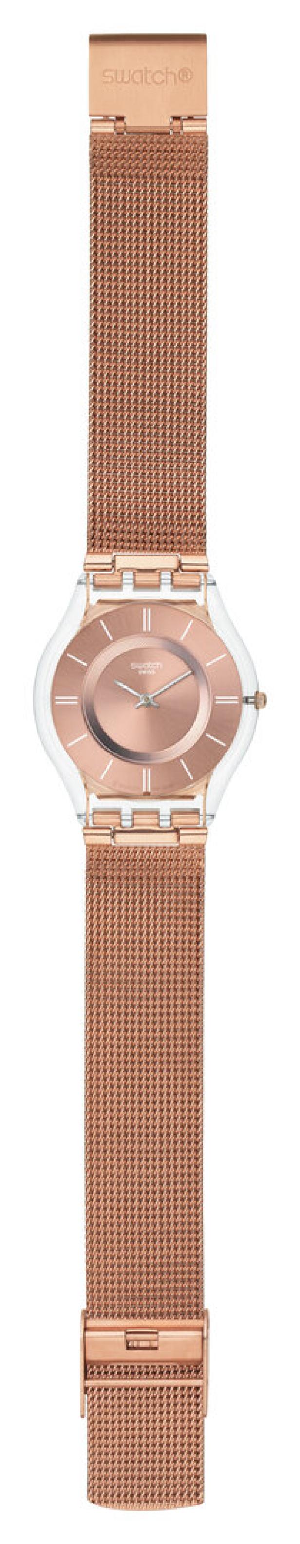 Eine Swatch-Uhr mit roségoldfarbenem Mesh-Armband und transparentem Gehäuse.