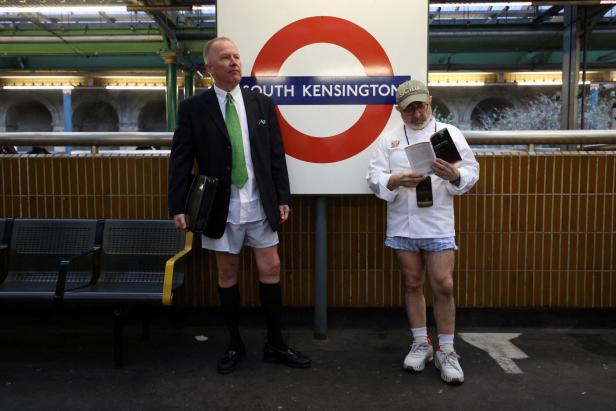 People travel on the London Underground during the "No Trousers Tube Ride" in London