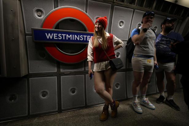 People travel on the London Underground during the "No Trousers Tube Ride" in London