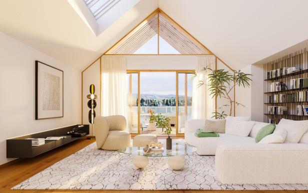 Ein weißes, elegantes und luxuriöses Wohnzimmer mit Blick auf einen See