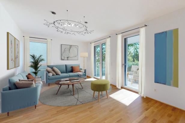 Wohnzimmer mit blauen Möbeln und Holzböden, gemütlich und einladend gestaltet.