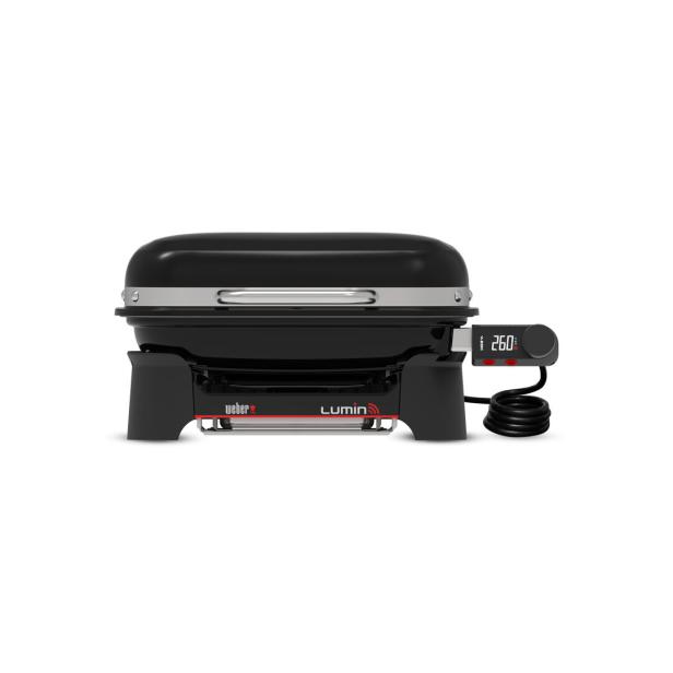 Ein schwarzer Weber Lumin Elektrogrill mit digitalem Thermometer.