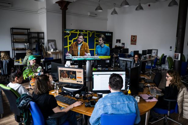 Journalists of the independent news outlet Telex work at their newsroom in Budapest