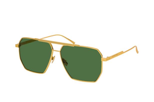 Eine goldene Bottega Veneta Sonnenbrille mit grünen Gläsern.
