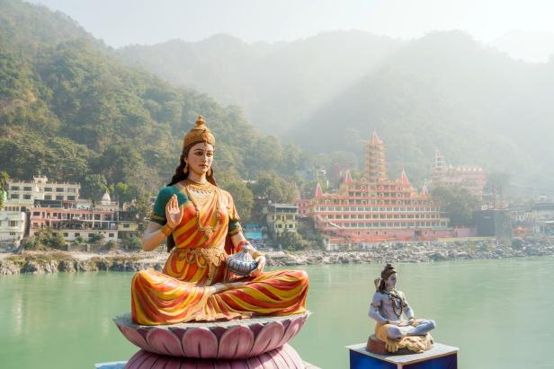 Statue of sitting goddess Parvati and Statue Shiva on the riverbank of Ganga in Rishikesh. Statue of sitting goddess Parvati and Statue Shiva on the riverbank of Ganga in Rishikesh.