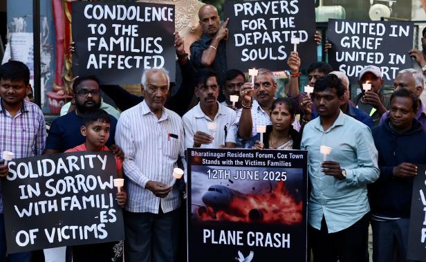 People hold candlelight vigil for Air India flight crash victims in Bangalore