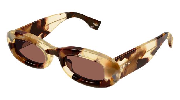 Eine Gucci-Sonnenbrille mit braun getönten Gläsern und einem Rahmen in Schildpattoptik.