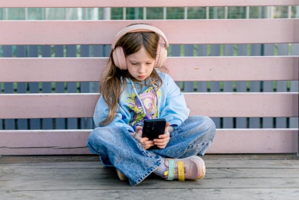 A Girl With Headphones  Studies An Online Letakes Selfies And Chats On Social Networks.